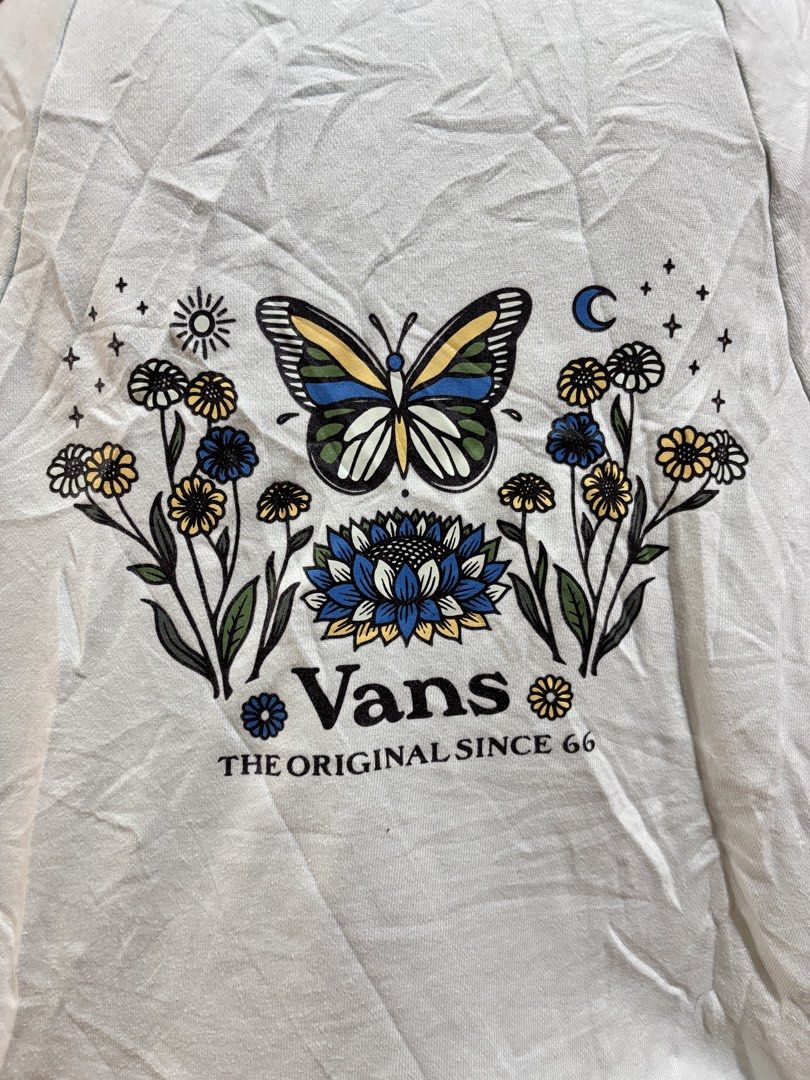Vans Zip-Up Hoodie - Light Blue - Size Medium (Category: Coats, Jackets and Outerwear) located in Manila. Submitted by danirivera21 (Listing ID 1462438856, Image 3). Description: - Light blue Vans zip-up hoodie - Size: Medium - Graphic: Butterfly and floral design on the back, small Vans logo on the chest - Features: Drawstring hood, front pockets - Style: Great for casual wear.