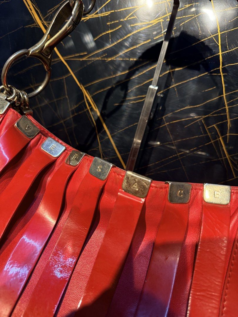 Versace Red Leather Hobo bag (Category: Shoulder Bags) located in Santiago. Submitted by twicebutnice03 (Listing ID 1462302882, Image 3). Description: Authentic Versace hobo bag Size medium Still Great Condition.