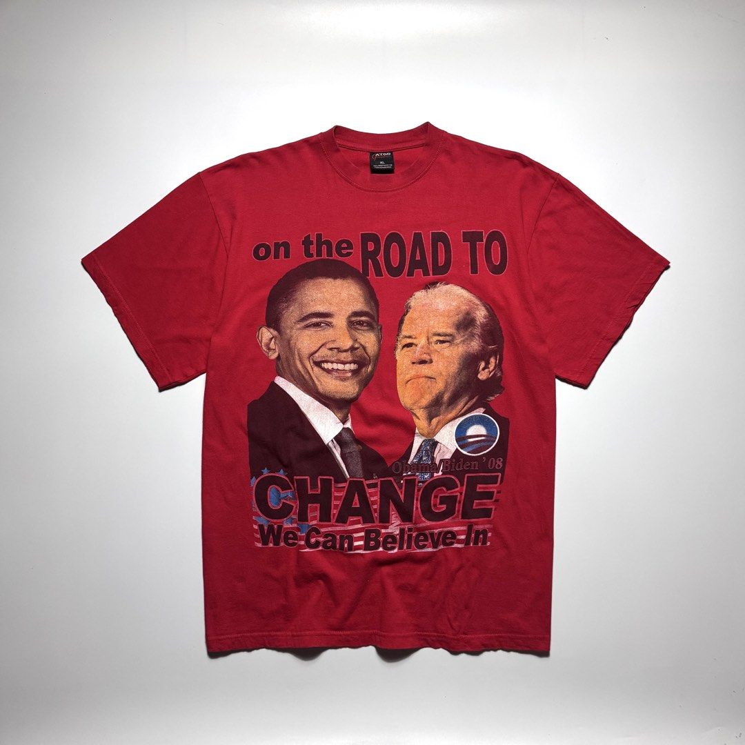 VINTAGE 2008 OBAMA BIDEN TEE (Category: Tshirts & Polo Shirts ) located in Cebu City. Submitted by firenzegallery (Listing ID 1462425515, Image 1). Description: - Authentic 2008 Obama-Biden campaign red t-shirt - Features 'On The Road To Change' slogan - Includes portraits of Barack Obama and Joe Biden - Bold and clear graphic print - Size XL - Made by ATOM - Perfect for collectors and supporters.