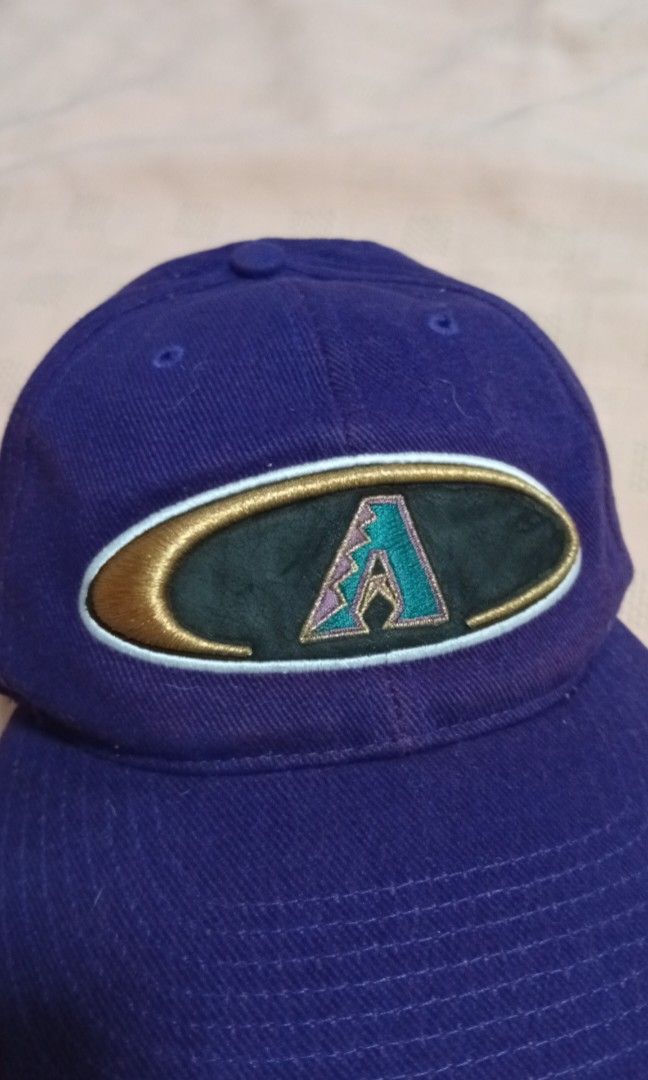 Vintage Arizona Diamondbacks Embroidered Logo Cap (Category: Caps & Hats) located in Quezon City. Submitted by jojoleen28 (Listing ID 1462335335, Image 3). Description: Rare design. Box Seat MLB Genuine Merchandise. Velcro adjustable back attachment. The black material on the logo, when touched, leaves some black marks on the fingers. Slight cracking on the cap in that portion. Otherwise no other issues. #Christmas2026.
