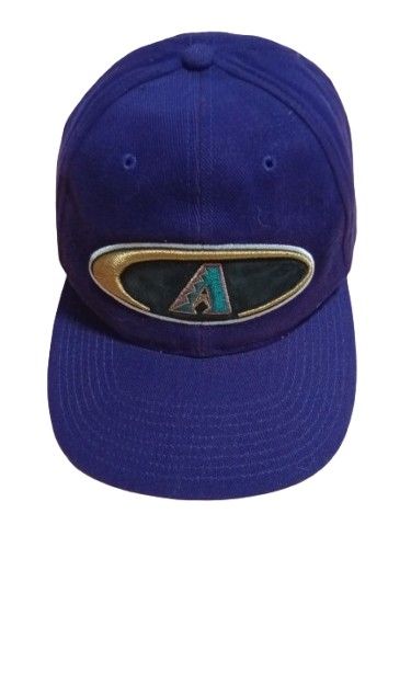 Vintage Arizona Diamondbacks Embroidered Logo Cap (Category: Caps & Hats) located in Quezon City. Submitted by jojoleen28 (Listing ID 1462335335, Image 1). Description: Rare design. Box Seat MLB Genuine Merchandise. Velcro adjustable back attachment. The black material on the logo, when touched, leaves some black marks on the fingers. Slight cracking on the cap in that portion. Otherwise no other issues. #Christmas2026.