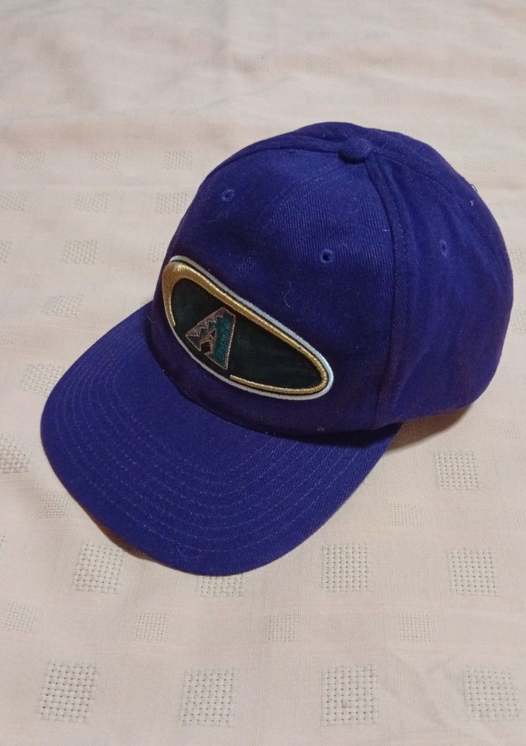 Vintage Arizona Diamondbacks Embroidered Logo Cap (Category: Caps & Hats) located in Quezon City. Submitted by jojoleen28 (Listing ID 1462335335, Image 2). Description: Rare design. Box Seat MLB Genuine Merchandise. Velcro adjustable back attachment. The black material on the logo, when touched, leaves some black marks on the fingers. Slight cracking on the cap in that portion. Otherwise no other issues. #Christmas2026.