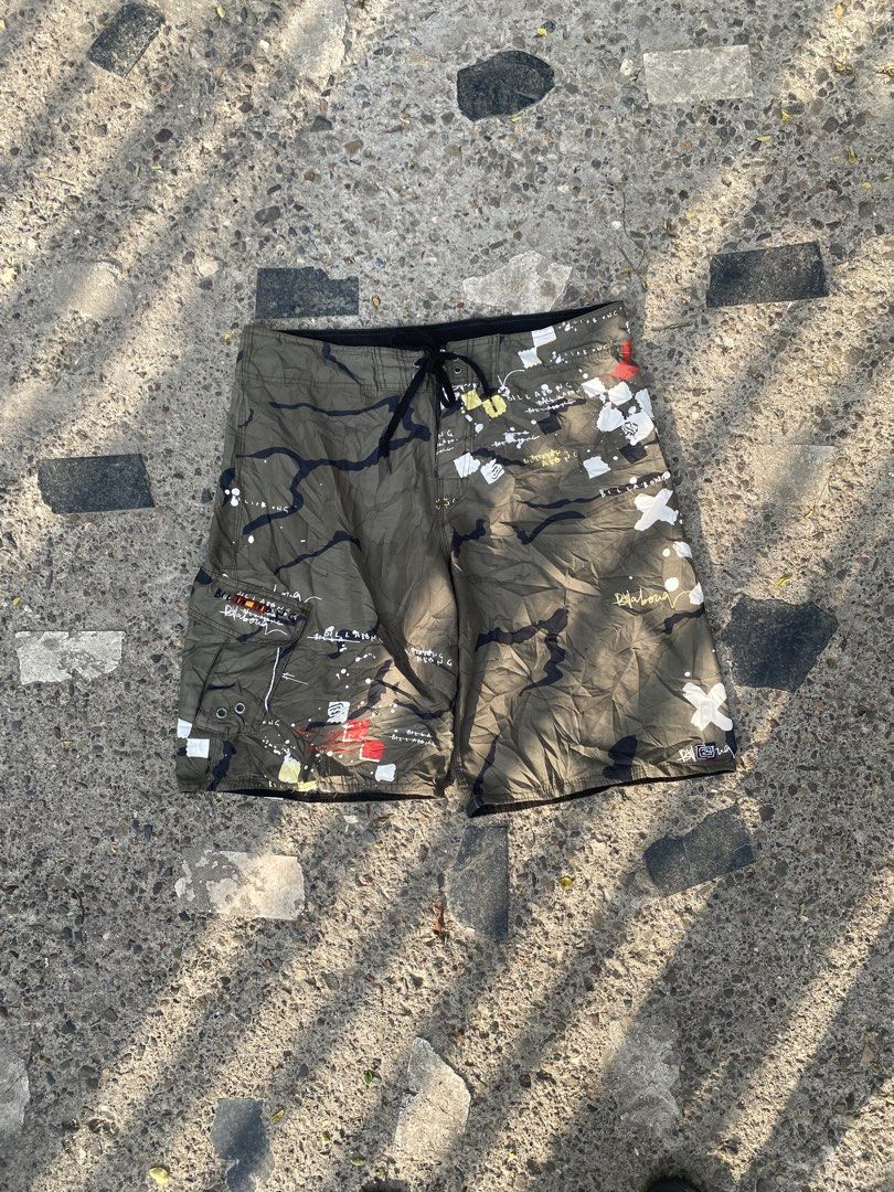 Vintage Billabong Camo Paint Splatter Board Shorts (Category: Shorts) located in Caloocan City. Submitted by gaylawanna22819 (Listing ID 1462437101, Image 1). Description: - Cool Billabong board shorts - Unique camouflage and paint splatter graphic print - Drawstring waist for adjustable fit - Convenient side cargo pocket - Ideal for beach, pool, or any adventure.