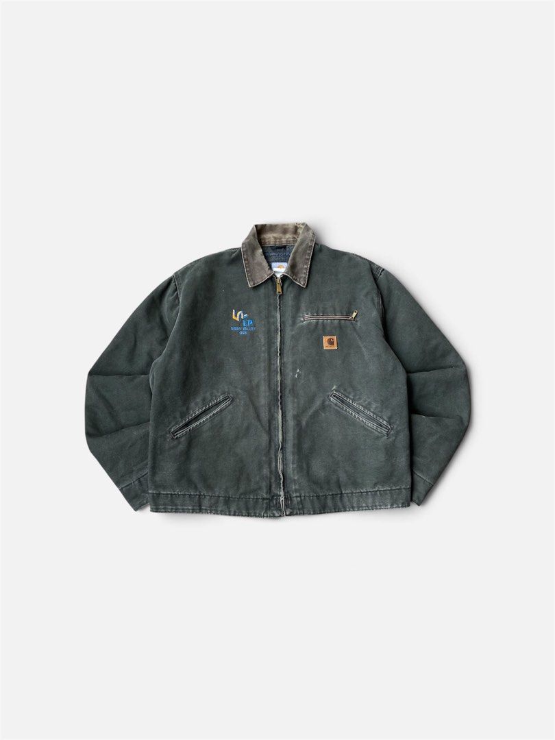 Vintage Carhartt J97 MOS (Category: Coats, Jackets and Outerwear) located in Manukan. Submitted by parasathrift. (Listing ID 1462433039, Image 1). Description: Vintage Carhartt J97 MOS Detroit Jacket Dated 2003 In a Good Condition Large on tag Dimes: 25 x 26 Boxyfit Color rate: 9/10.