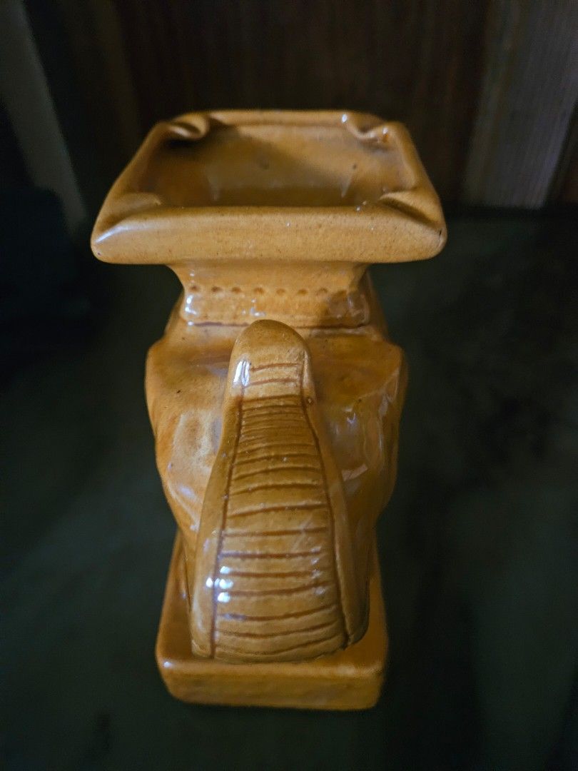 Vintage Ceramic Elephant Ashtray (Category: Other Home Decor) located in Antipolo. Submitted by pengzkibus-92087 (Listing ID 1462327650, Image 2). Description: Cute ceramic elephant, perfect as a bookend or decor. Features a glossy amber glaze. Adds charm to shelves/desks. Ideal for elephant enthusiasts..