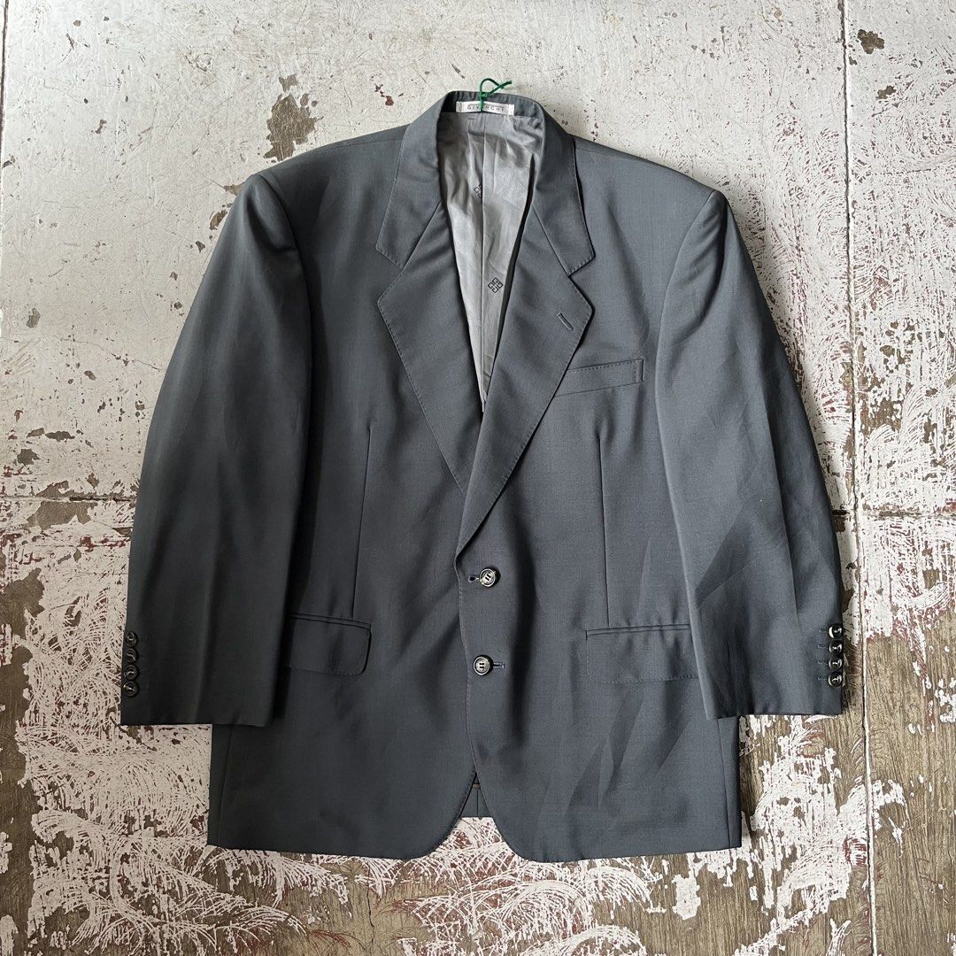 VINTAGE GIVENCHY single-breasted wool blazer with notch lapels, a multi-button front, and structured shoulders. (Category: Coats, Jackets and Outerwear) located in Iloilo. Submitted by plugsta (Listing ID 1462346600, Image 1). Description: GIVENCHY SIZE: M-L MEASUREMENTS LAID FLAT (IN INCHES): WIDTH: 22 LENGTH: 29 SLEEVE LENGTH: 21 SS: 18.5 CONDITION: EXCELLENT FLAW/S: NONE.