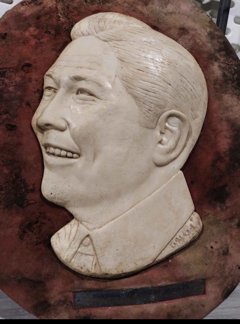 Vintage Marcos and Imelda Wall Plaques (Category: Wall Decor) located in Mandaluyong City. Submitted by LEATHERFACE (Listing ID 1462278978, Image 2). Description: - Set of two vintage wall plaques - Features busts of Ferdinand Marcos and Imelda Marcos - Mounted on circular, textured backings - Shows some signs of age and wear on the backing - Ideal for collectors or unique home decor.