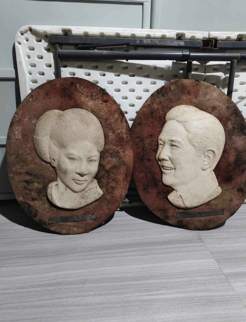 Vintage Marcos and Imelda Wall Plaques (Category: Wall Decor) located in Mandaluyong City. Submitted by LEATHERFACE (Listing ID 1462278978, Image 1). Description: - Set of two vintage wall plaques - Features busts of Ferdinand Marcos and Imelda Marcos - Mounted on circular, textured backings - Shows some signs of age and wear on the backing - Ideal for collectors or unique home decor.