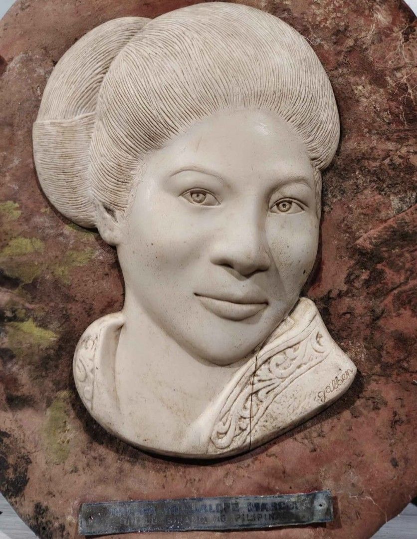 Vintage Marcos and Imelda Wall Plaques (Category: Wall Decor) located in Mandaluyong City. Submitted by LEATHERFACE (Listing ID 1462278978, Image 3). Description: - Set of two vintage wall plaques - Features busts of Ferdinand Marcos and Imelda Marcos - Mounted on circular, textured backings - Shows some signs of age and wear on the backing - Ideal for collectors or unique home decor.