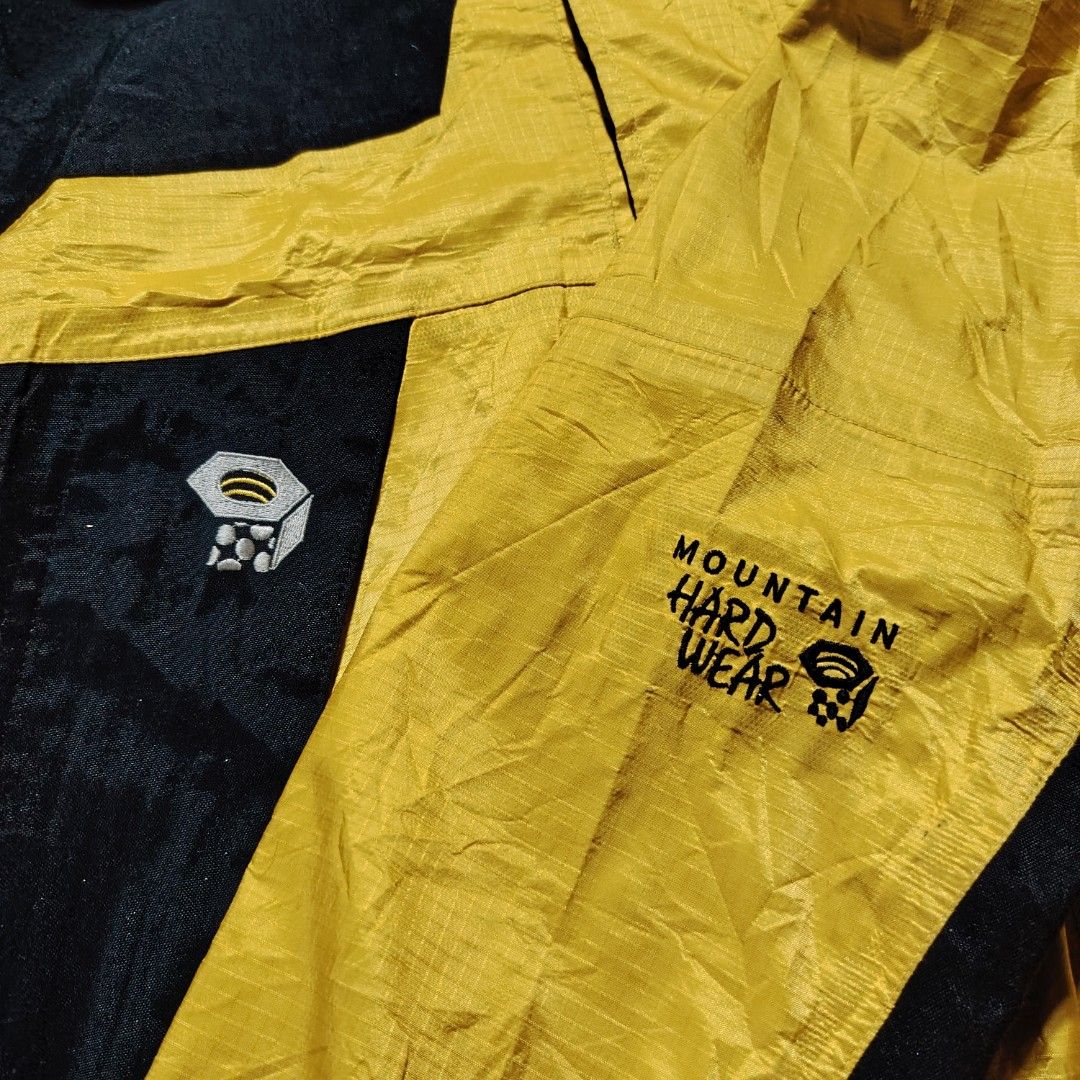 Vintage Mountain Hardwear Paradigm Jacket (Category: Coats, Jackets and Outerwear) located in General Santos City (Dadiangas). Submitted by angelodemegilloceballos (Listing ID 1462430140, Image 3). Description: - Brand: Mountain Hardwear - Color: Yellow and Black - Type: Shell Jacket - Size: Men's Medium (M) - Features: Hooded with adjustable drawstrings, Zipper closure, Two front pockets - Ideal for: Outdoor activities and adventures.