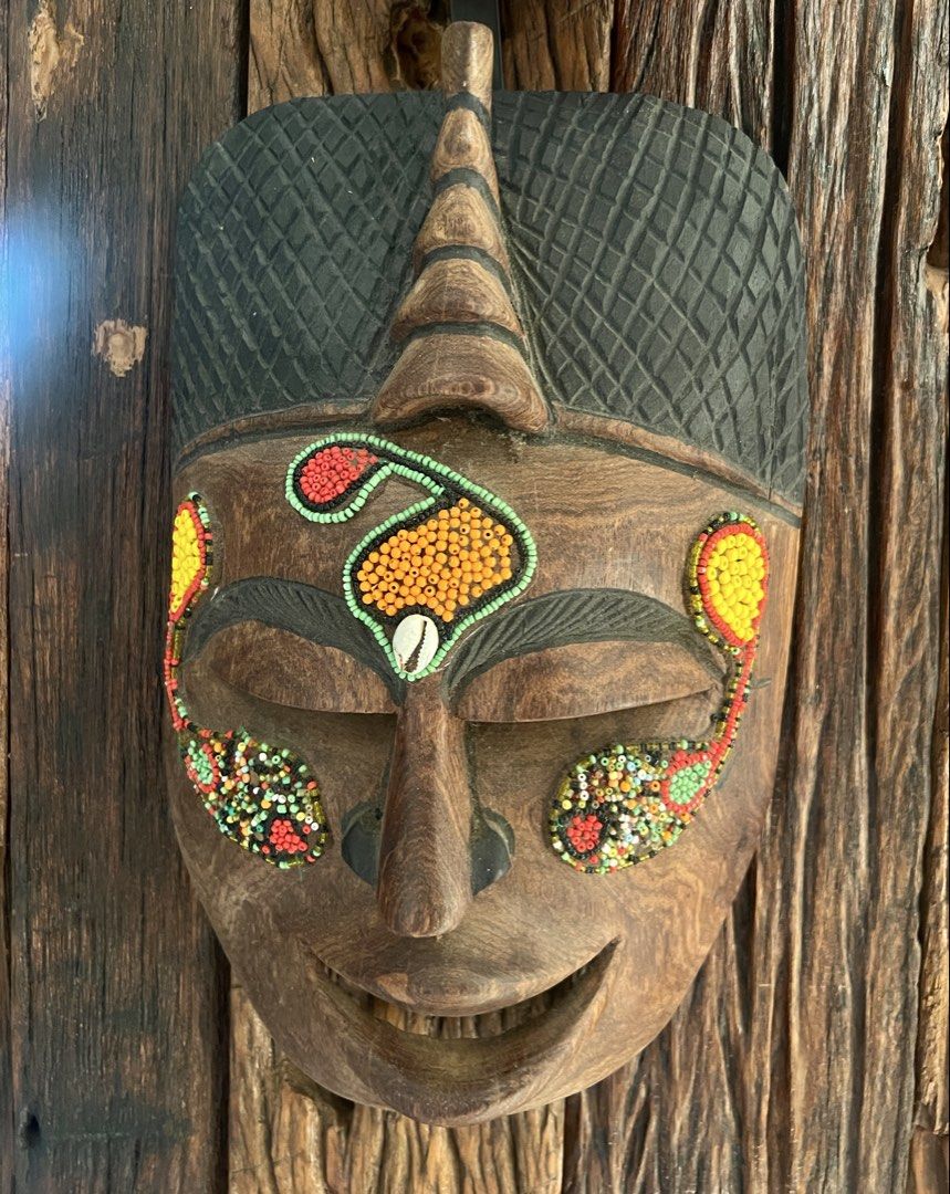 Vintage Tribal Mask Wall Decor (Category: Wall Decor) located in Rosario. Submitted by chasiebananie (Listing ID 1462297535, Image 3). Description: - Crafted from wood, some with intricate beadwork; papier-mâché - Ideal for enhancing home decor or creating cultural displays - Adds character and a unique touch to any room Personally collected. Most of the masks are from Nepal and one from Africa. One small mask is broken (black) so I am just givin