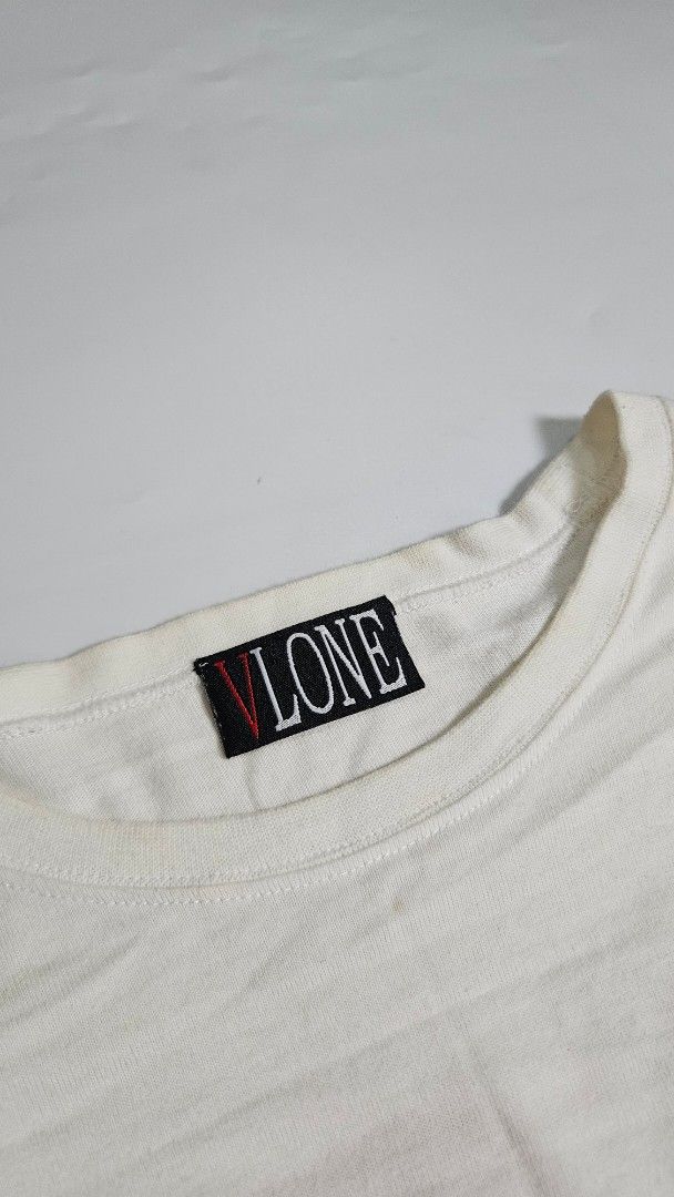 Vlone Staple Reversible White Long Sleeve (Category: Tshirts & Polo Shirts ) located in Alfonso. Submitted by jbcamet (Listing ID 1462415789, Image 2). Description: - Brand: VLONE - Color: White - Style: Long Sleeve Tee - Design: Signature V logo on back, large text graphic on front - Material: Cotton - Origin: Made in China - Care: Refer to label for instructions.
