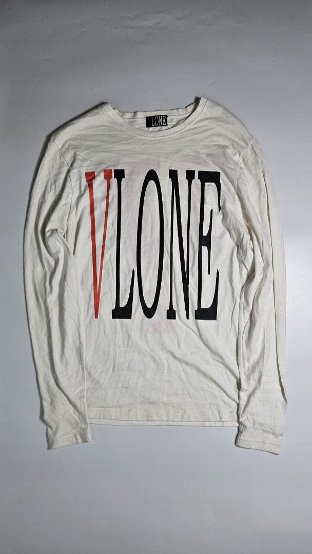 Vlone Staple Reversible White Long Sleeve (Category: Tshirts & Polo Shirts ) located in Alfonso. Submitted by jbcamet (Listing ID 1462415789, Image 1). Description: - Brand: VLONE - Color: White - Style: Long Sleeve Tee - Design: Signature V logo on back, large text graphic on front - Material: Cotton - Origin: Made in China - Care: Refer to label for instructions.