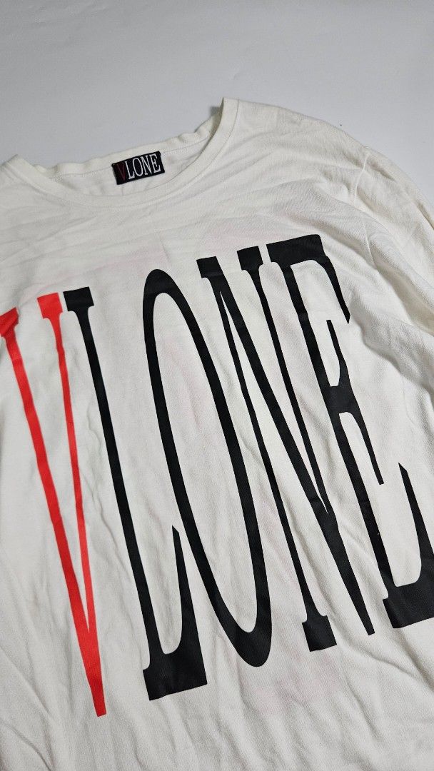 Vlone Staple Reversible White Long Sleeve (Category: Tshirts & Polo Shirts ) located in Alfonso. Submitted by jbcamet (Listing ID 1462415789, Image 3). Description: - Brand: VLONE - Color: White - Style: Long Sleeve Tee - Design: Signature V logo on back, large text graphic on front - Material: Cotton - Origin: Made in China - Care: Refer to label for instructions.
