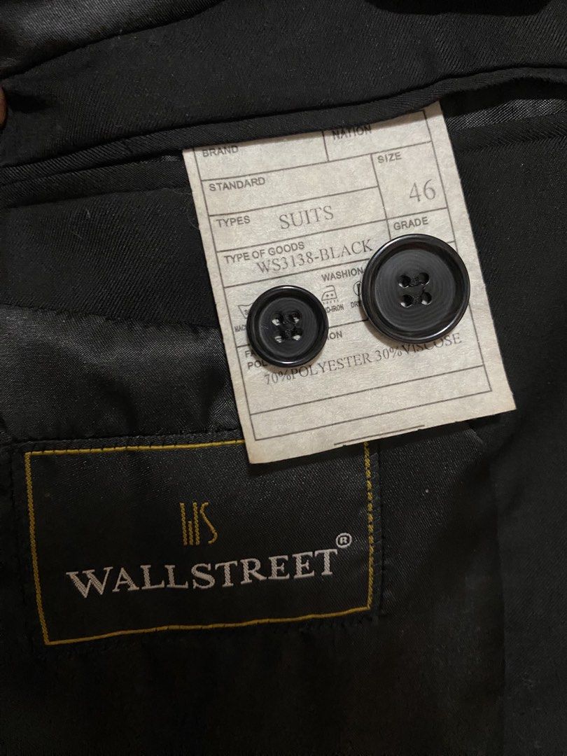 Wall Street Black Suit Jacket (Category: Coats, Jackets and Outerwear) located in Quezon City. Submitted by babyblue2022 (Listing ID 1462296372, Image 3). Description: - Professionally dry-cleaned already - Brand: Wall Street - Color: Black - Size: M - Material: 70% Polyester, 30% Viscose - Closure: Single button - Details: Subtle dark grey trim on lapels and pockets - Occasion: Formal events, business wear.