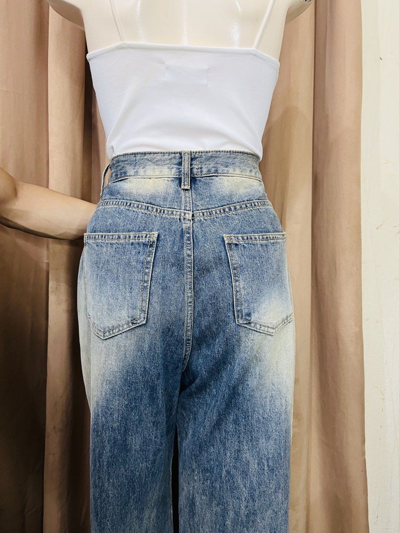 Washed Denim Wide Leg Jeans (Category: Jeans) located in Manila. Submitted by bengirlclothing (Listing ID 1462432951, Image 3). Description: -Size: 27-28 inches (tape measured base) -Length: 42inches (tape measured base) - Washed denim jeans - Wide leg silhouette - High-waisted fit - Gradient wash effect (light blue to dark blue) - Ideal for a casual and stylish look - Pairs well with simple tops.