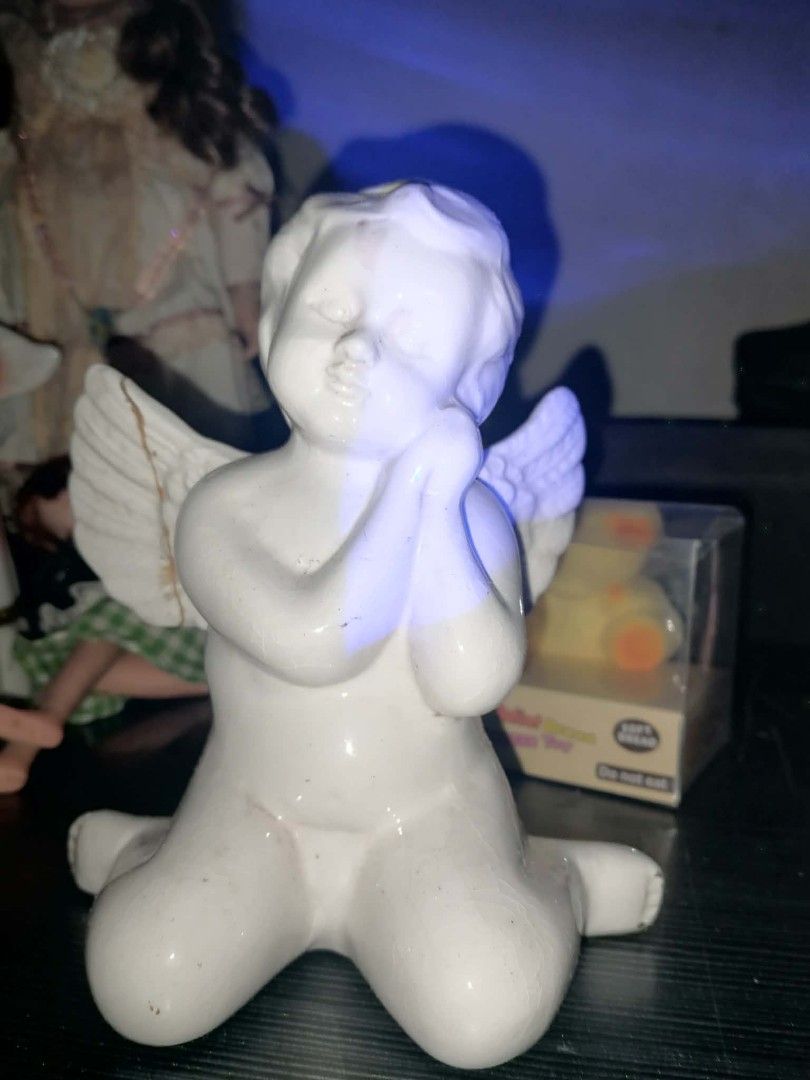 White Ceramic Angel Figurine Praying (Category: Other Home Decor) located in Manila. Submitted by juicyjclov3r (Listing ID 1462393770, Image 1). Description: - Adorable white ceramic angel figurine - Depicts an angel kneeling with hands clasped in prayer - Features beautifully detailed wings - Ideal for home decor or as a thoughtful gift.