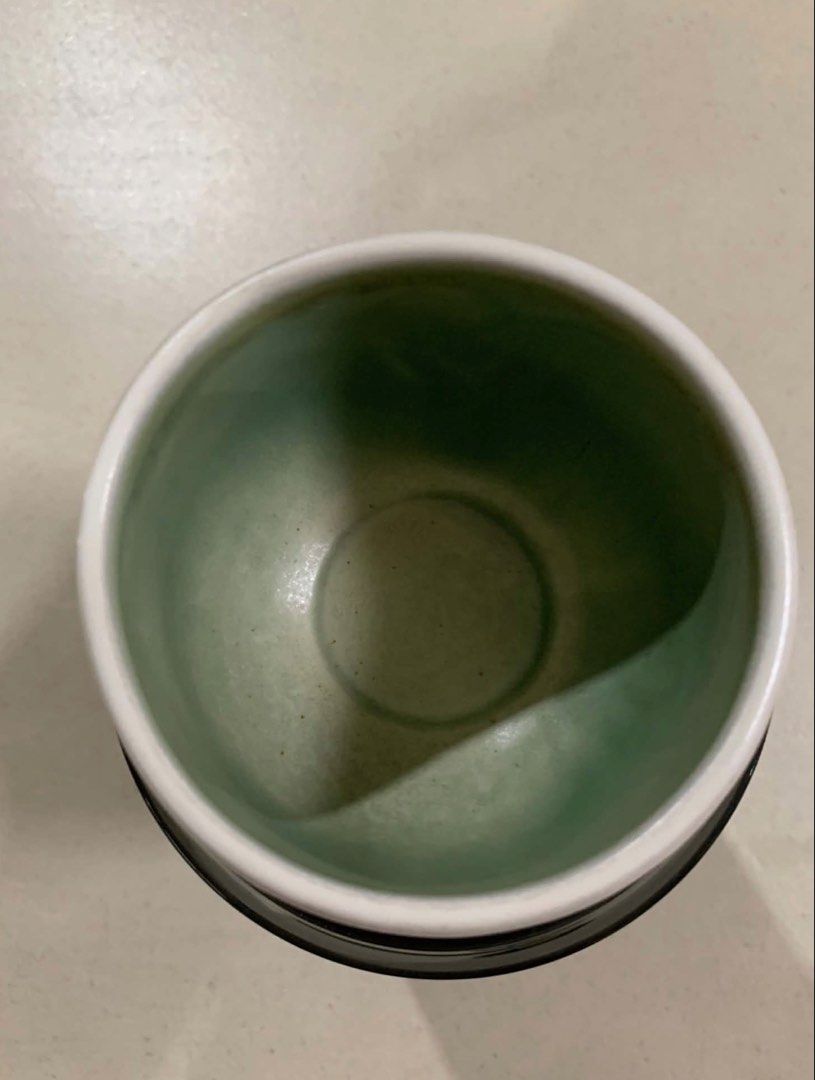 White Ceramic Cup with Green Interior (Category: Coffee & Tea Tableware) located in Quezon City. Submitted by meggoquingco (Listing ID 1462381851, Image 3). Description: - White ceramic cup with a vibrant green interior. - Ideal for enjoying your favorite tea or coffee. - Features a simple and classic design..