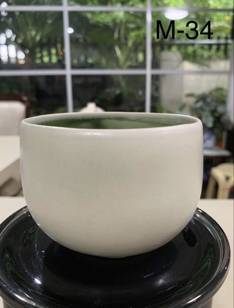 White Ceramic Cup with Green Interior (Category: Other Kitchenware & Tableware) located in Quezon City. Submitted by meggoquingco (Listing ID 1462382502, Image 1). Description: - White ceramic pot with a vibrant green glazed interior. - Ideal for drinking tea or coffee.
