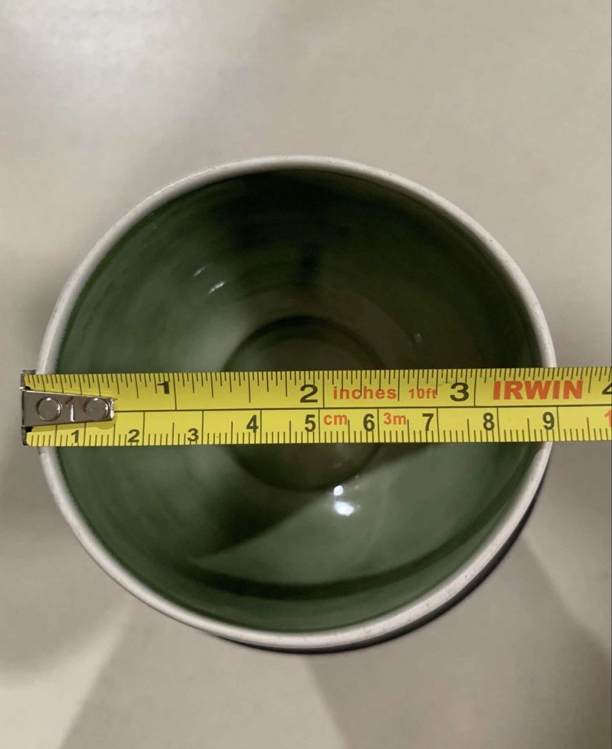 White Ceramic Cup with Green Interior (Category: Other Kitchenware & Tableware) located in Quezon City. Submitted by meggoquingco (Listing ID 1462382502, Image 3). Description: - White ceramic pot with a vibrant green glazed interior. - Ideal for drinking tea or coffee.