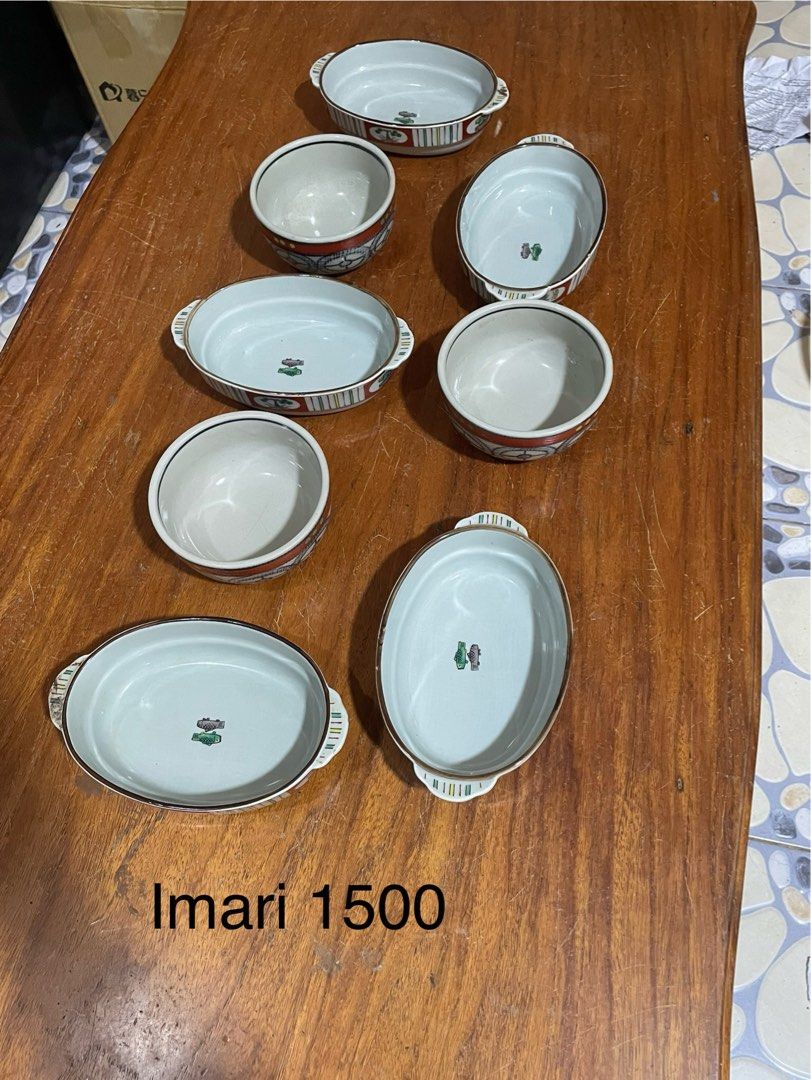 White Ceramic Teapot and Cups Set (Category: Coffee & Tea Tableware) located in Manila. Submitted by simon.0916 (Listing ID 1462436144, Image 2). Description: - Classic white ceramic teapot with 4 matching cups - Set of Imari ware oval dishes with floral patterns - Two Nikko fine bone china cups and saucers - Japanese-style sake set (2 flasks, multiple small cups) with floral design.