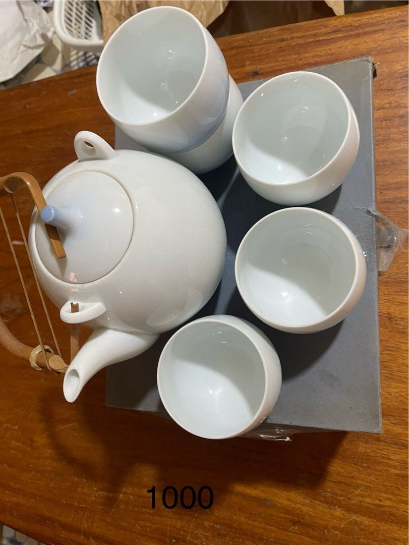 White Ceramic Teapot and Cups Set (Category: Coffee & Tea Tableware) located in Manila. Submitted by simon.0916 (Listing ID 1462436144, Image 1). Description: - Classic white ceramic teapot with 4 matching cups - Set of Imari ware oval dishes with floral patterns - Two Nikko fine bone china cups and saucers - Japanese-style sake set (2 flasks, multiple small cups) with floral design.