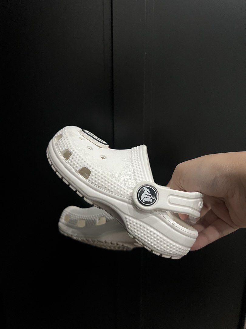 White Crocs with Basketball and Number Charms (Category: Slippers & Slides) located in Baliuag. Submitted by shop.avg (Listing ID 1462315313, Image 3). Description: - White Crocs with basketball and number charms - Easy slip-on and off design - Ideal for casual wear - Perfect for kids or anyone who loves fun shoes C7.