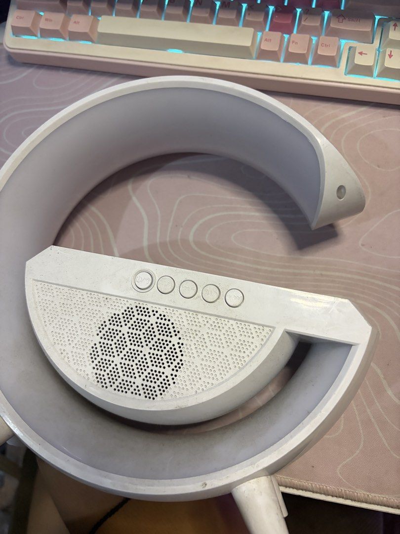 White Curved Desk Lamp with Built-in Speaker (Category: Lighting) located in Manila. Submitted by laulokinstr (Listing ID 1462312002, Image 1). Description: - Stylish white curved lamp - Integrated speaker for music or podcasts - Easy-to-use control buttons on top - Ideal addition to any desk setup - Fully functional and works well.