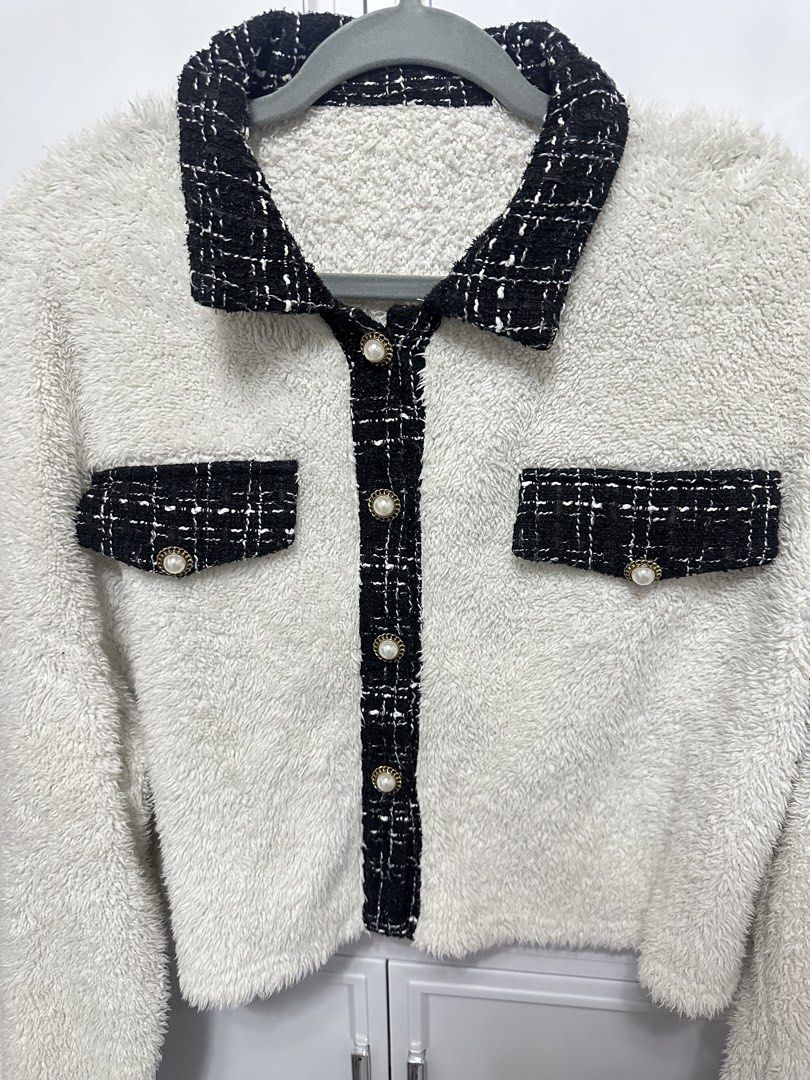 White Fuzzy Jacket with Black Tweed Trim (Category: Coats, Jackets and Outerwear) located in Quezon City. Submitted by jeydeegmr (Listing ID 1462410786, Image 2). Description: - Super soft white fuzzy fabric - Chic black tweed trim on collar, pockets, and cuffs - Pearl-like button front closure - Cropped length for a stylish silhouette - Ideal for cozy layering.