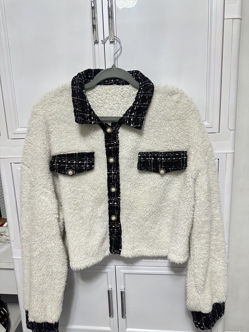 White Fuzzy Jacket with Black Tweed Trim (Category: Coats, Jackets and Outerwear) located in Quezon City. Submitted by jeydeegmr (Listing ID 1462410786, Image 1). Description: - Super soft white fuzzy fabric - Chic black tweed trim on collar, pockets, and cuffs - Pearl-like button front closure - Cropped length for a stylish silhouette - Ideal for cozy layering.