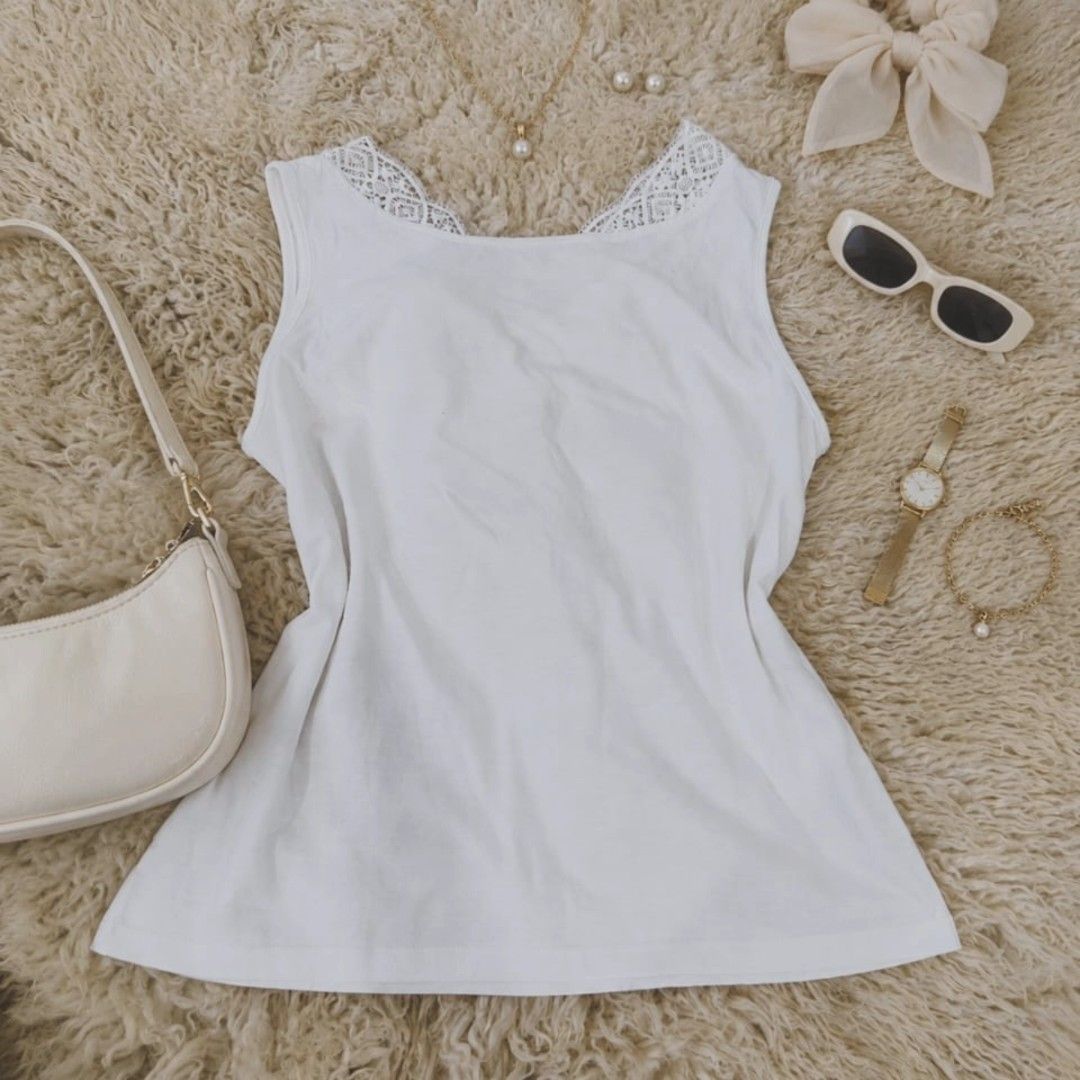 White Lace-Trimmed Sleeveless Top (Category: Coats, Jackets and Outerwear) located in Manila. Submitted by t.flavelle (Listing ID 1462428072, Image 3). Description: FOR SALE White Lace-Trimmed Sleeveless Top • Preloved / Used condition • Size Medium • Classic white color • Sleeveless design • Delicate lace detail on the shoulders • Simple and feminine style • Soft and lightweight look • Easy to pair with jeans, skirts, shorts & trousers • Perfect