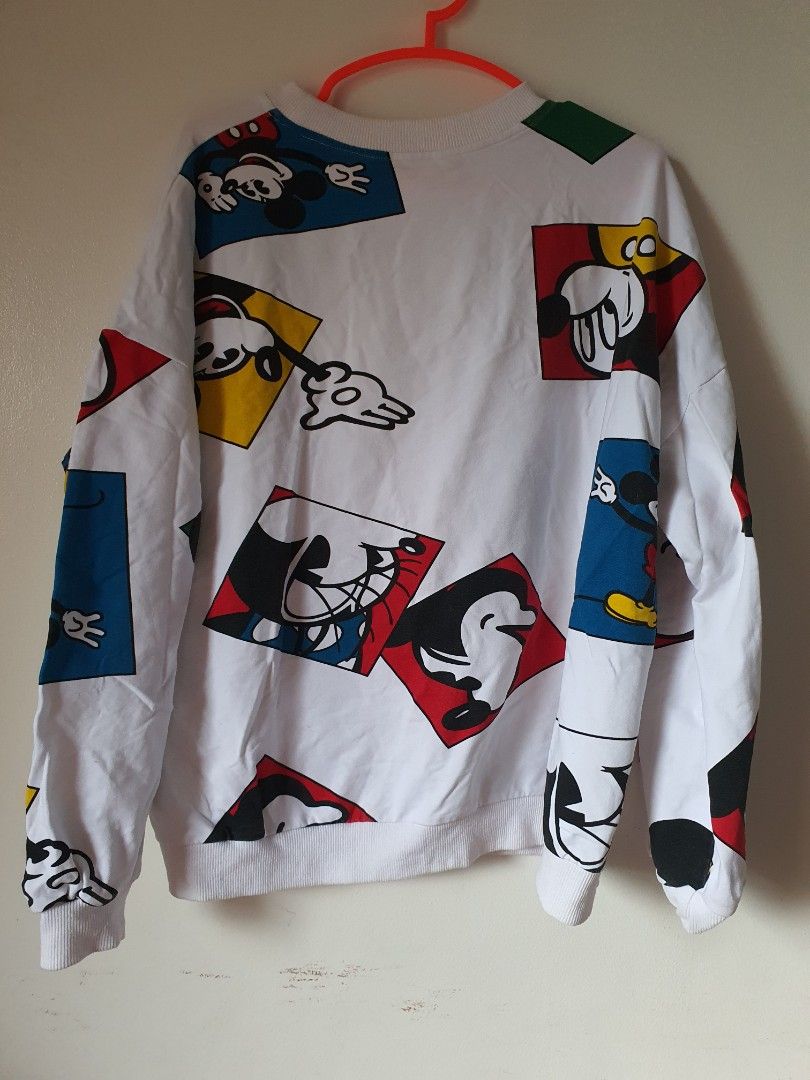 White Mickey Mouse Graphic Sweatshirt (Category: Longsleeves) located in Meycauayan. Submitted by shoptoown (Listing ID 1462268551, Image 2). Description: - White sweatshirt with a fun all-over Mickey Mouse graphic print. - Features various poses and colors of Mickey. - Ribbed cuffs and neckline for a comfortable fit. - Ideal for casual everyday wear. - Measurements: Pit to pit approx. 23 inches, Length approx. 23 inches..