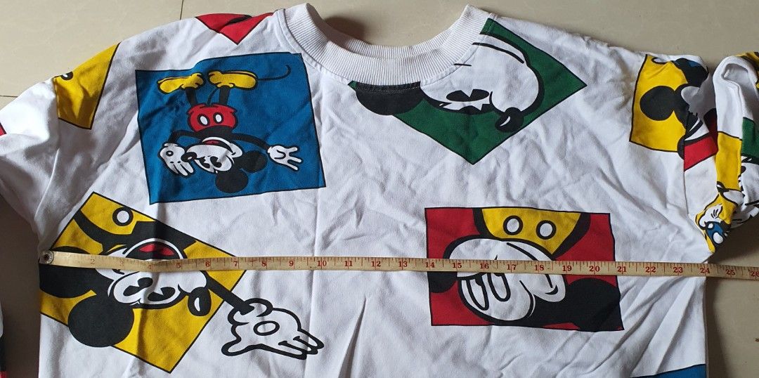 White Mickey Mouse Graphic Sweatshirt (Category: Longsleeves) located in Meycauayan. Submitted by shoptoown (Listing ID 1462268551, Image 3). Description: - White sweatshirt with a fun all-over Mickey Mouse graphic print. - Features various poses and colors of Mickey. - Ribbed cuffs and neckline for a comfortable fit. - Ideal for casual everyday wear. - Measurements: Pit to pit approx. 23 inches, Length approx. 23 inches..