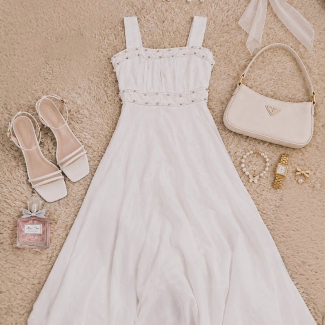 White Midi Dress (Category: Dresses) located in Manila. Submitted by t.flavelle (Listing ID 1462427790, Image 1). Description: White Midi Dress • Preloved / Used condition • Size XS • Soft and classic white color • Elegant sleeveless design • Feminine and timeless silhouette • Clean and minimalist style • Flowy and effortlessly flattering look • Perfect for casual days, dates, brunch & special occasions • Easy to pair with heels, sandals & dainty