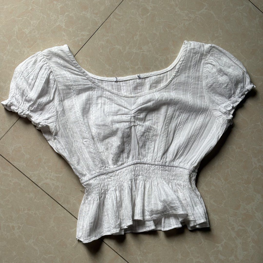 White Puff Sleeve Smocked Peplum Top (Category: Blouses) located in Manila. Submitted by glenkm (Listing ID 1462292631, Image 1). Description: - White top with puff sleeves. - Smocked waist for a comfortable fit. Fits up to semi S.