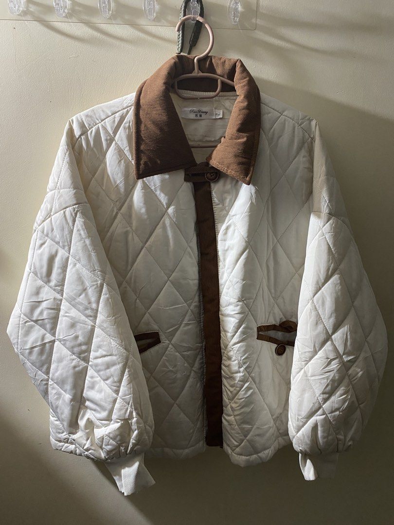 White Quilted Jacket with Brown Corduroy Collar (Category: Coats, Jackets and Outerwear) located in Manila. Submitted by jiro0628 (Listing ID 1462431009, Image 1). Description: - White quilted jacket - Brown corduroy accents on collar and trim - Button closure - Pocket details - Elasticated cuffs and hem - Ideal for layering.
