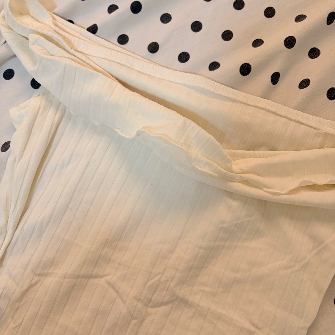 White Ribbed Off-Shoulder top (Category: Others Tops) located in Pasay City. Submitted by notellyyyy (Listing ID 1462278626, Image 2). Description: - White ribbed bodysuit - Off-shoulder design with ruffled neckline - Asymmetrical hemline - Stretchy material for a comfortable fit - Ideal for layering or wearing as a standalone piece - Pairs perfectly with jeans or skirts.