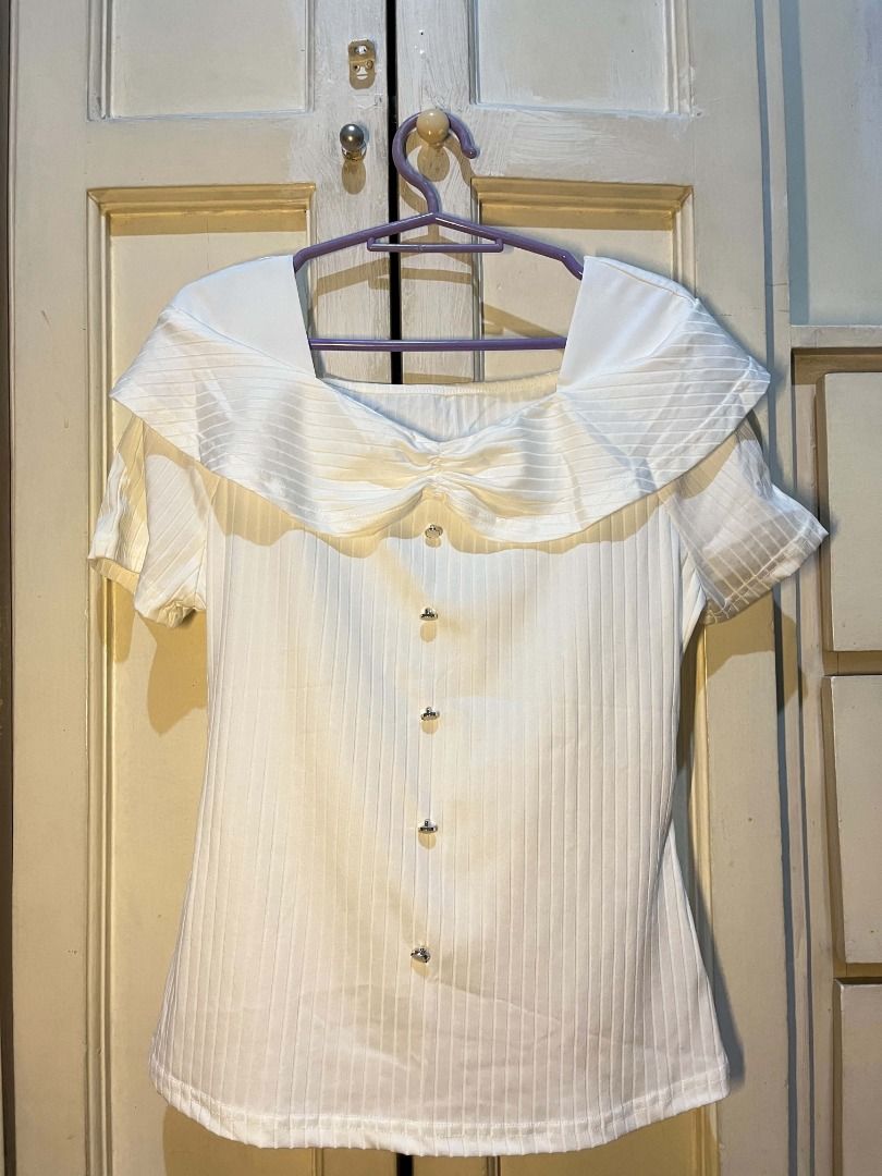 White Square Neck Ribbed Top with Ruffle Collar (Category: Blouses) located in Quezon City. Submitted by bunniezen (Listing ID 1462355670, Image 1). Description: - White ribbed fabric - Square neckline - Short sleeves with layered ruffle detail - Comfortable and stylish - Easy to pair with skirts or pants.