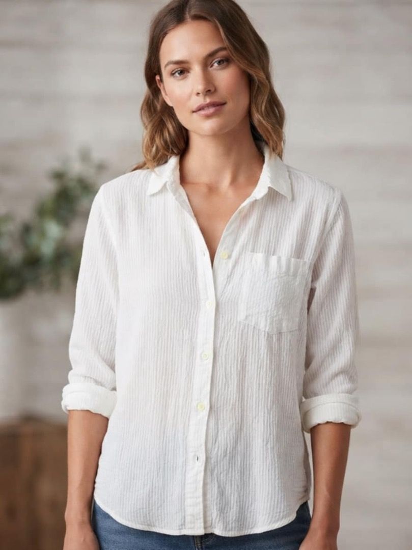White Textured Long Sleeve Button Up Shirt (Category: Tshirts & Polo Shirts ) located in Tanjay. Submitted by madscart (Listing ID 1462399794, Image 2). Description: - Classic white button-up shirt - Textured fabric for a nice feel - Long sleeves (can be rolled up) - Features a chest pocket - Versatile for casual and smart casual looks - Pairs well with jeans or trousers.