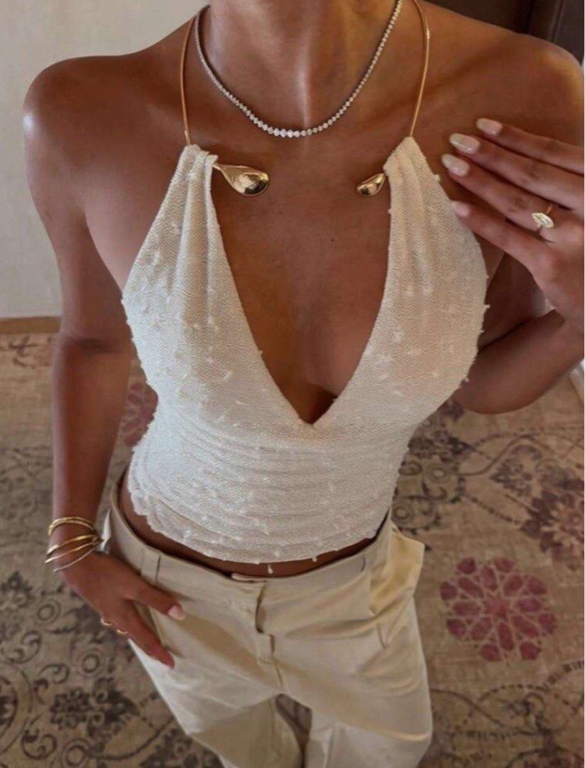 White and gold halter neck top (Category: Sleeveless) located in Manila. Submitted by s4intoffduty (Listing ID 1462420446, Image 1). Description: altered it a bit dm for details .