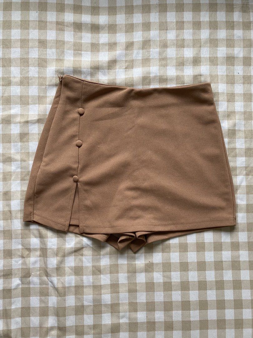 Declutter Bundle: 5 Pieces Shorts & Skort (Casual, Athletic, Lounge) (Category: Other Bottoms) located in Santa Maria. Submitted by closetclearout_co (Listing ID 1462277204, Image 3). Description: Shorts & Skort Declutter Bundle (5 Pieces) Selling all 5 bottoms together at a discounted price! Includes: 1 Pair of Subdued tan/khaki casual drawstring shorts with front pockets 1 Camel brown side-button wrap skort 1 Pair of black sporty shorts with do
