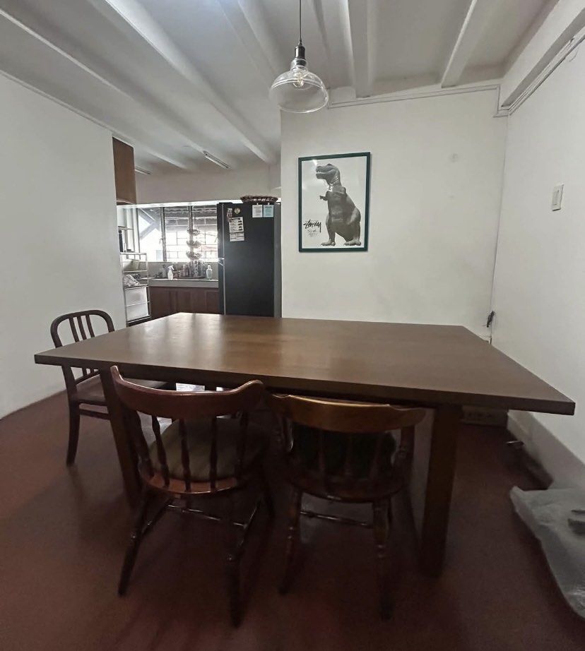 Wooden Dining Table with 4 Chairs (Category: Tables & Sets) located in Quezon City. Submitted by timelesstoys.avk (Listing ID 1462375933, Image 1). Description: - Solid wood dining table and four chairs - Seats four people comfortably - Two chairs with classic spindle back design - Two chairs with modern slatted back design - Ideal for dining room or kitchen nook - Table surface has minor wear - Chairs are sturdy and well-maintained.