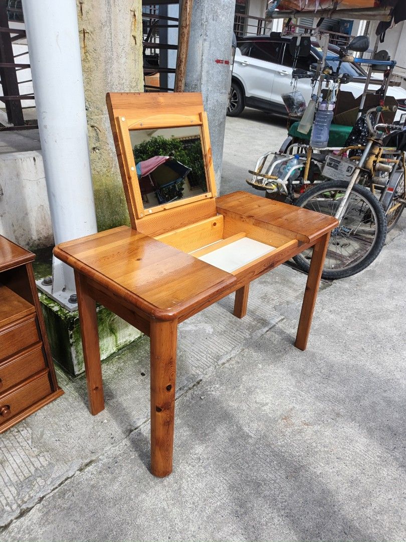 Wooden Dressing Table with Mirror and Storage (Category: Tables & Sets) located in Valenzuela. Submitted by kendra071914 (Listing ID 1462268721, Image 3). Description: - Solid wood dressing table - Features a flip-up mirror - Includes a convenient storage compartment - Beautiful warm wood tone - Sturdy and reliable legs - Perfect as a vanity or small desk.