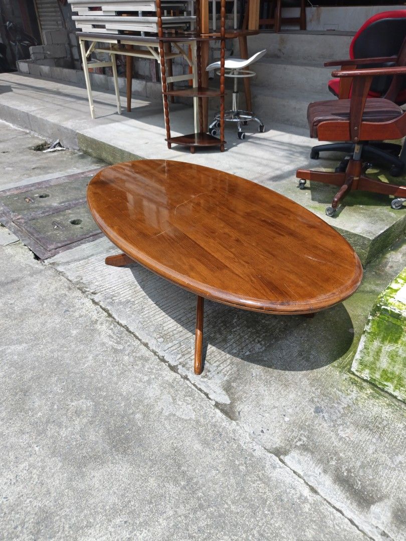 Wooden Oval Coffee Table solid wood Japan surpluz (Category: Tables & Sets) located in Valenzuela. Submitted by kendra071914 (Listing ID 1462266922, Image 2). Description: - Solid wood coffee table with an elegant oval top. - Features a beautiful, warm wood tone. - Supported by four stable legs for durability. - Dimensions: Height 38cm, Length 135cm, Width 74cm. - Ideal for enhancing your living room or lounge area. - Pick up only..