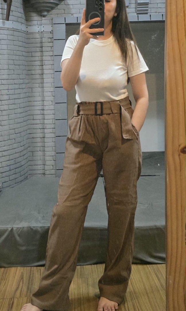 Woven Buckle Pants (Category: Other Bottoms) located in Manila. Submitted by kayencee_27 (Listing ID 1462418562, Image 2). Description: Brandnew Pants With clear plastic Paperbag style Garterized Waist - 26"-38" Length - 38" Avail colors:khaki, choco, rust.