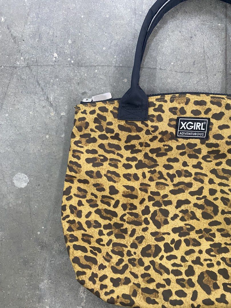X-Girl Leopard Print Tote Bag (Category: Tote Bags) located in San Jose del Monte. Submitted by kidfromnclb (Listing ID 1462338644, Image 3). Description: - Cute X-Girl tote bag - All-over leopard print design - Black handles and zipper closure - Small X-Girl logo tag on the front - Spacious interior for your daily essentials - Ideal for everyday use.