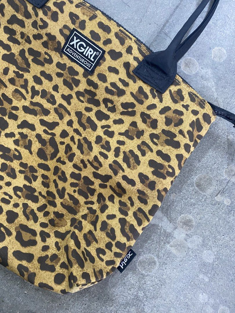 X-Girl Leopard Print Tote Bag (Category: Tote Bags) located in San Jose del Monte. Submitted by kidfromnclb (Listing ID 1462338644, Image 2). Description: - Cute X-Girl tote bag - All-over leopard print design - Black handles and zipper closure - Small X-Girl logo tag on the front - Spacious interior for your daily essentials - Ideal for everyday use.
