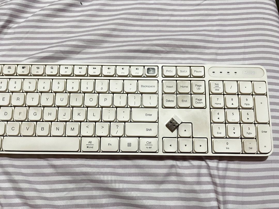 Xiaomi Wireless Keyboard White Full-Size Numeric Keypad (Category: Computer Keyboard) located in Binan City. Submitted by med.ph7 (Listing ID 1461297620, Image 1). Description: -⌨️ Xiaomi Wireless Keyboard — 104 Keys 💻 Full-size 104-key keyboard 📡 2.4GHz wireless connection 🔌 Comes with wireless receiver 🔋 Uses 2 AAA batteries 💻 Compatible with **Windows / Mac / Android / iOS 🔊 Fn keys for volume, mute & media controls ✨ Comfortable micro-c