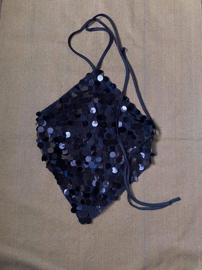 y2k Black Sequin Halter Top with Tie Straps (Category: Sleeveless) located in Caloocan City. Submitted by hoellyjane (Listing ID 1462291547, Image 1). Description: - Sparkly black halter top - Covered in shimmering sequins - Ties at the neck and back for an adjustable fit - Ideal for parties, nights out, or adding glam to any outfit - Fun and flirty design.