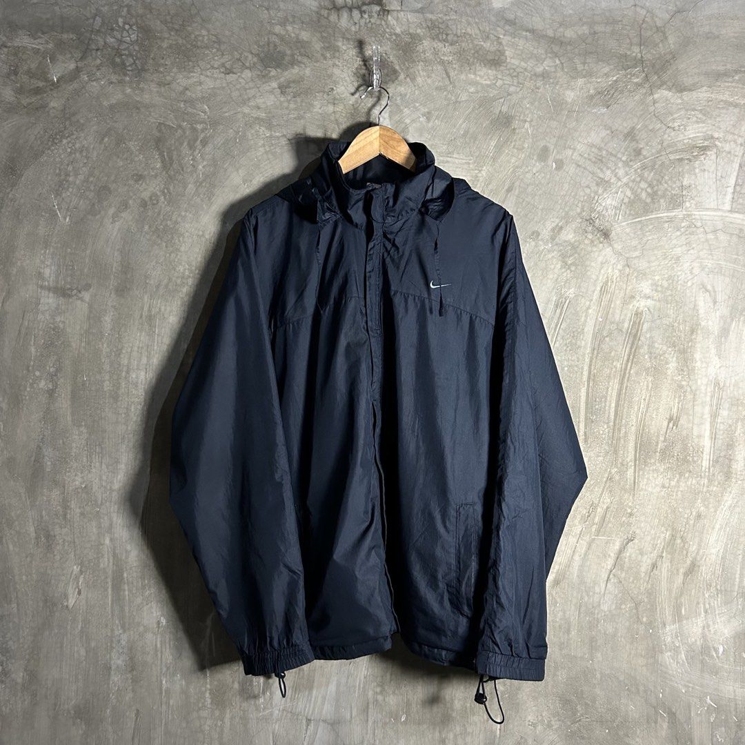 Y2k Nike - Basic Logo Windbreaker (Category: Coats, Jackets and Outerwear) located in Tayabas. Submitted by streetdepartment (Listing ID 1462267681, Image 1). Description: Y2k Nike - Basic Logo Windbreaker Measurements (inches): Width: 25.5” Length: 30.5” Tagged as XXL Packable Hoodie Very good condition Flaw/s: replace zipper, and stains.